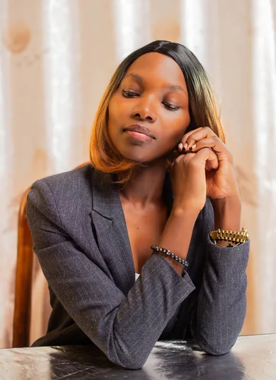 Woman in a blazer in an office setting