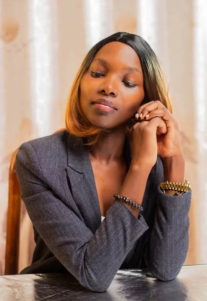 Woman in a blazer in an office setting