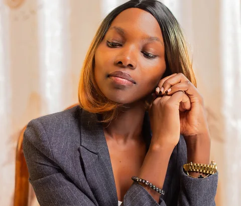 Woman in a blazer in an office setting