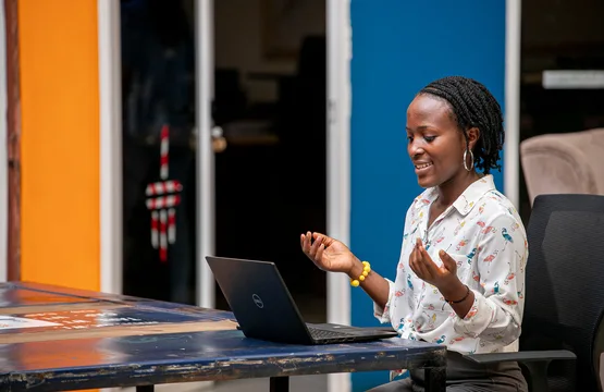 Woman using a laptop in Kampala
