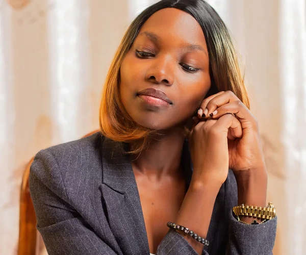 Woman in a blazer in an office setting