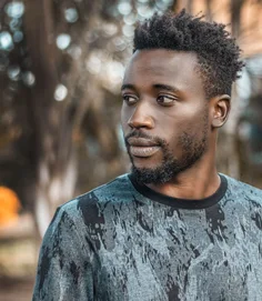 Man photographed outdoors in Kampala