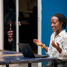 Woman using a laptop in Kampala