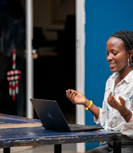 Woman using a laptop in Kampala