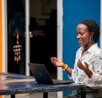 Woman using a laptop in Kampala