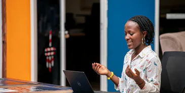 Woman using a laptop in Kampala