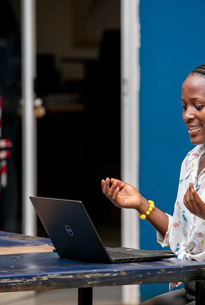 Woman using a laptop in Kampala