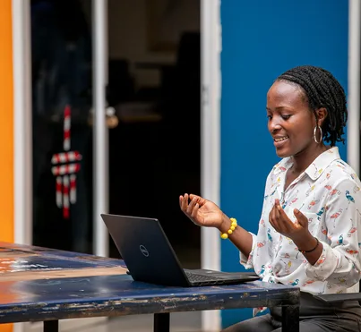 Woman using a laptop in Kampala