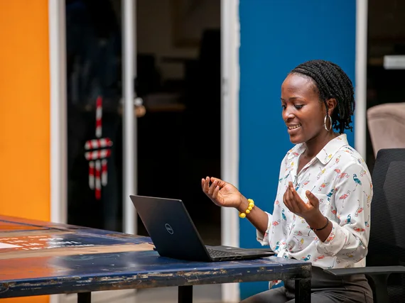 Woman using a laptop in Kampala