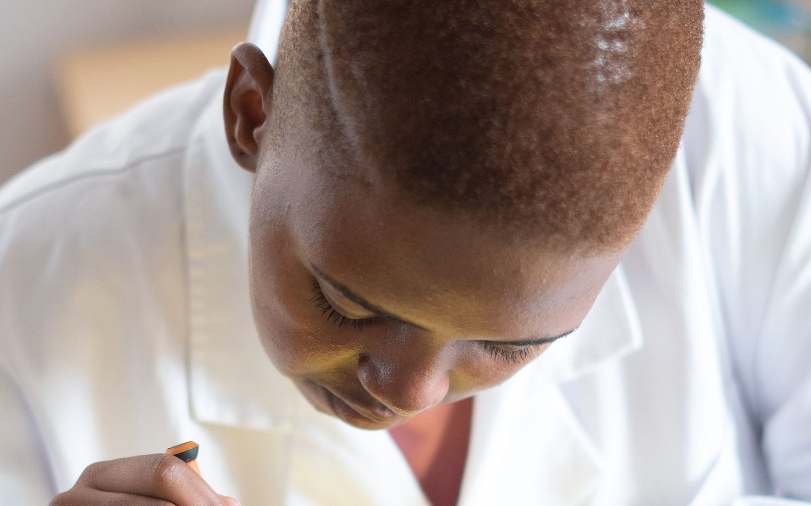 Black electronics technician testing a circuit board