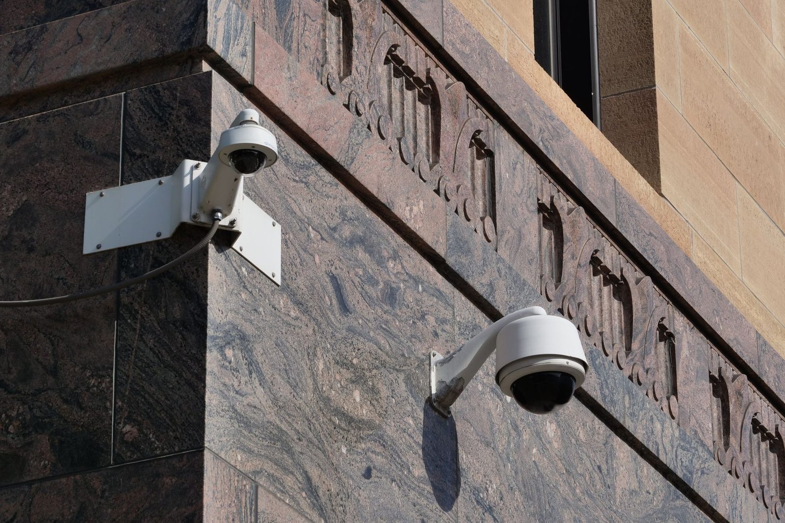 Modern surveillance cameras mounted on a building
