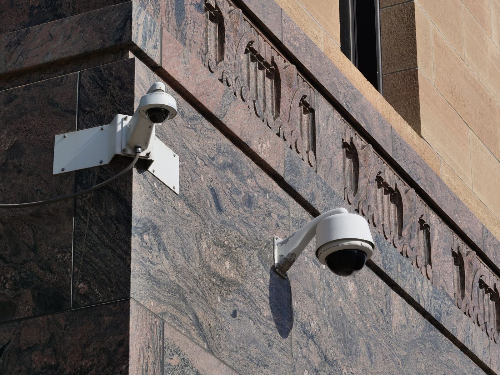 Modern surveillance cameras mounted on a building