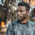 Man photographed outdoors in Kampala