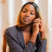 Woman in a blazer in an office setting