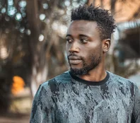 Man photographed outdoors in Kampala