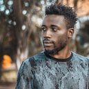 Man photographed outdoors in Kampala