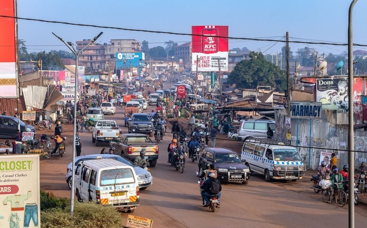 A busy Kampala street with local transport