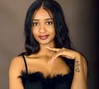 Woman photographed in a Kampala portrait studio