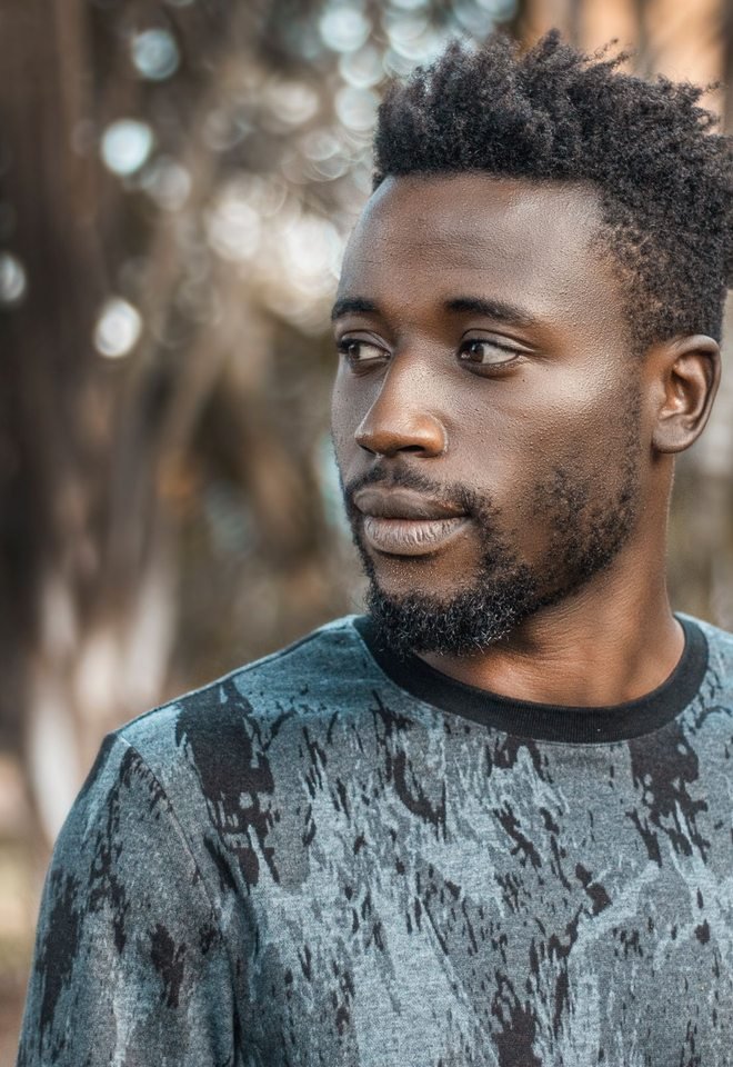 Man photographed outdoors in Kampala