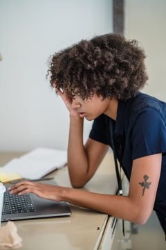 Black businesswoman working on a laptop