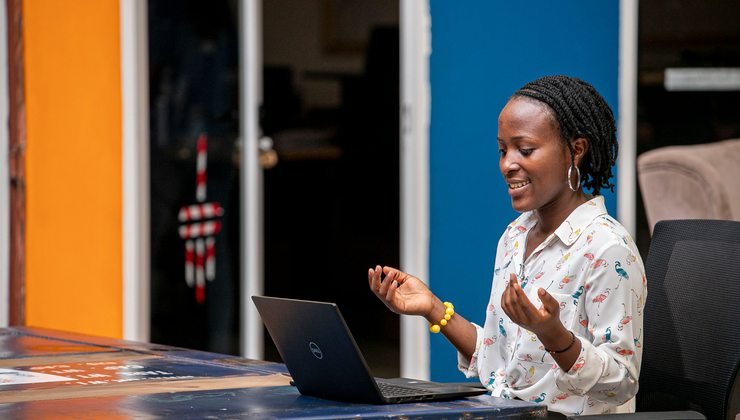 Woman using a laptop in Kampala