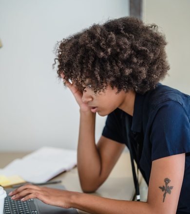 Black businesswoman working on a laptop