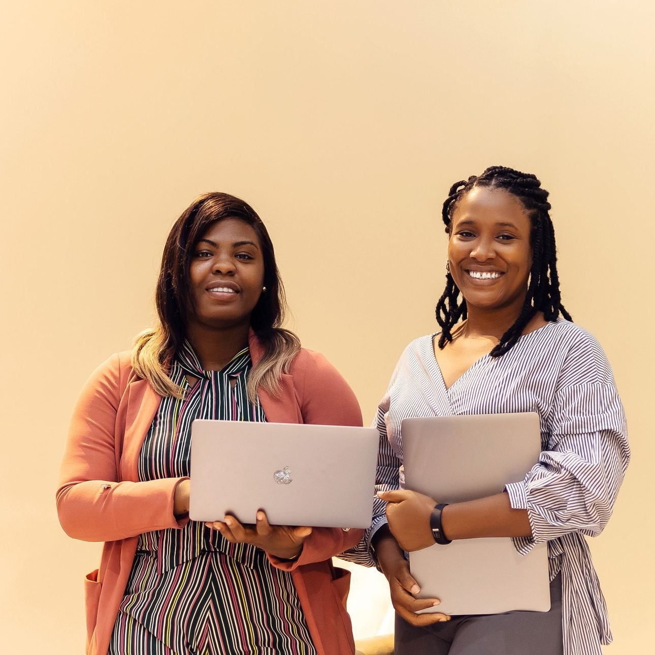 African businesswomen collaborating with laptops