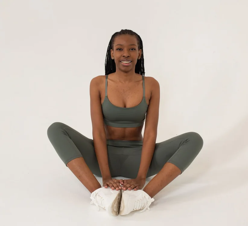 Black woman practising seated yoga