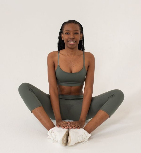 Black woman practising seated yoga
