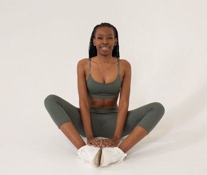 Black woman practising seated yoga
