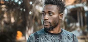 Man photographed outdoors in Kampala