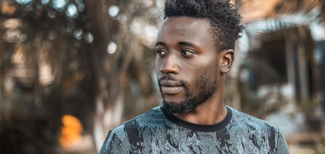 Man photographed outdoors in Kampala
