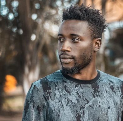Man photographed outdoors in Kampala