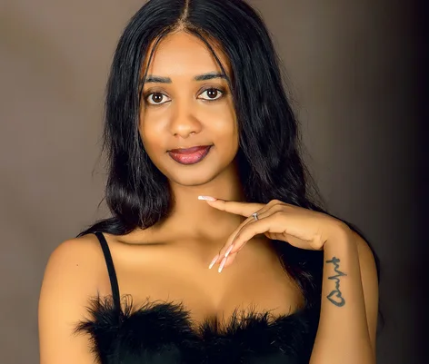 Woman photographed in a Kampala portrait studio