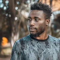 Man photographed outdoors in Kampala