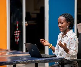 Woman using a laptop in Kampala