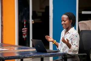 Woman using a laptop in Kampala