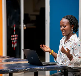 Woman using a laptop in Kampala