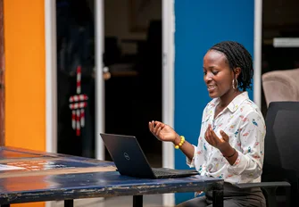 Woman using a laptop in Kampala
