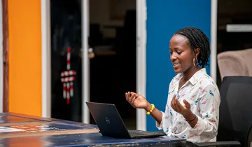 Woman using a laptop in Kampala