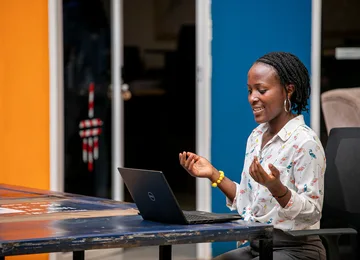 Woman using a laptop in Kampala