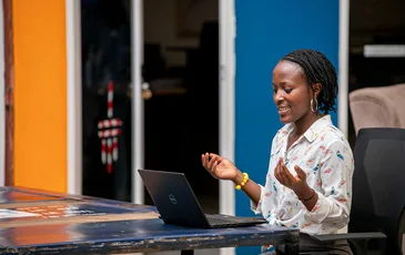 Woman using a laptop in Kampala