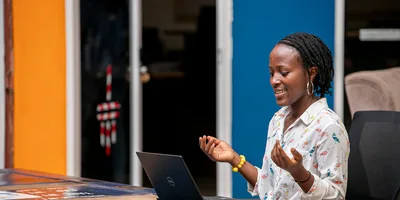 Woman using a laptop in Kampala