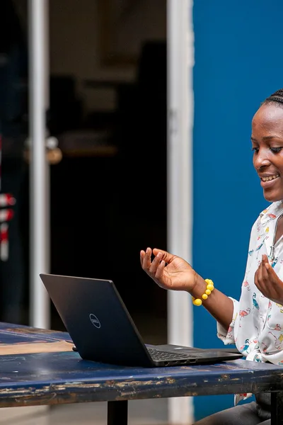 Woman using a laptop in Kampala