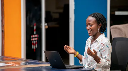 Woman using a laptop in Kampala