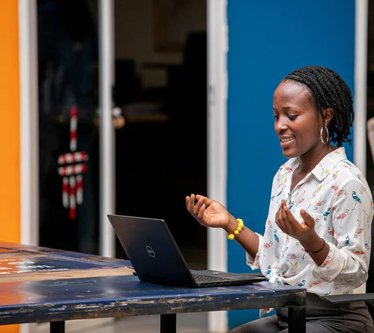 Woman using a laptop in Kampala