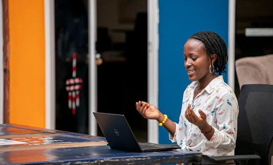 Woman using a laptop in Kampala