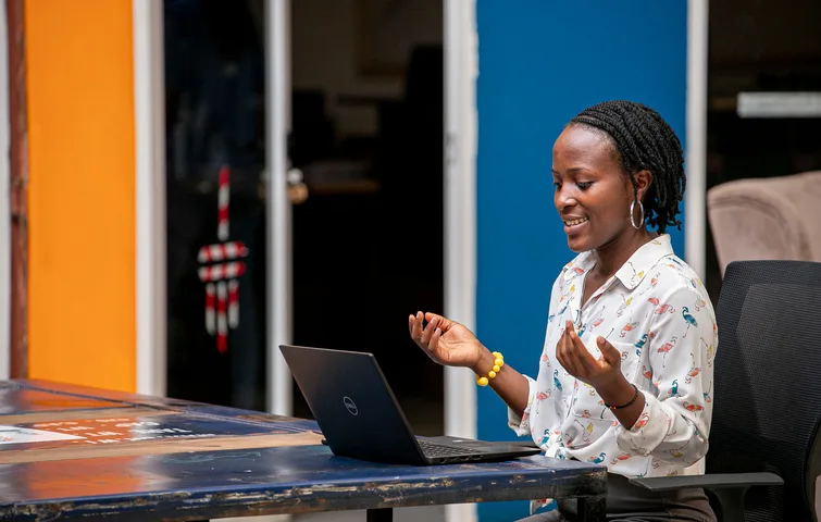Woman using a laptop in Kampala