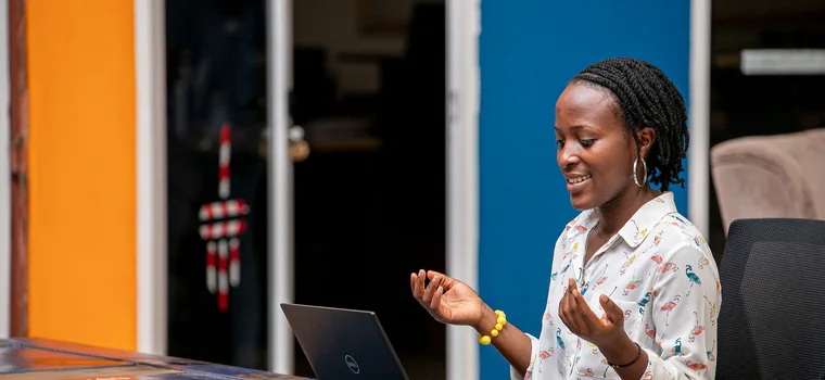 Woman using a laptop in Kampala