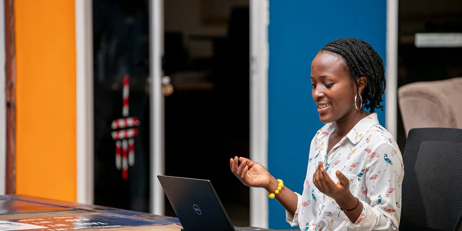 Woman using a laptop in Kampala